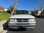 Front view of a 1996 Ford Ranger with 113,000 miles, showing its well-maintained exterior.