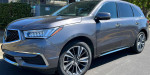 2020 Acura MDX in excellent condition with new tires, battery, and features; salvage title vehicle for sale.