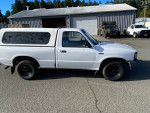 White Mazda B2300 pickup truck for sale, 149,000 miles, 5-speed, clean title, check engine light on.