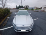 Front view of a silver 2016 Ford Fusion S FWD parked, showcasing its sleek design and features.