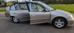 2004 Honda Civic EX in silver with open doors, showing interior and low mileage of 84,000 miles.