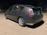 2010 Toyota Prius hybrid car, gray color, parked at night, features GPS and backup camera.