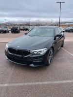 2018 BMW 540d xDrive diesel sedan with low miles, black exterior and Dakota leather interior, parked outdoors.