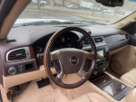 Interior view of 2007 GMC Yukon Denali with wood trim and control buttons