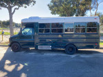 2002 Chevy Bluebird school bus conversion with 6.5L Turbo Diesel engine, ideal for camping and road trips.