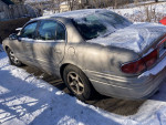 2000 Buick LeSabre parked in the snow, featuring new tires and battery, needs brakes.