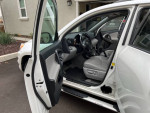 Interior view of a 2012 Toyota RAV4 with low mileage, featuring spacious seating and modern dashboard design.