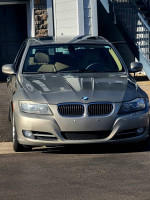 Front view of a 2010 BMW 3 Series 335i sedan in excellent condition with clean title and low mileage.