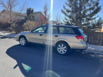 2008 Subaru Outback in great shape parked on the street, showcasing its all-wheel drive and stylish design.