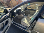 Interior view of a 2008 Subaru Outback showing comfortable seating and dashboard details.
