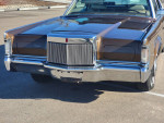Front view of a restored 1970 Lincoln Continental Mark III with polished body and chrome details.