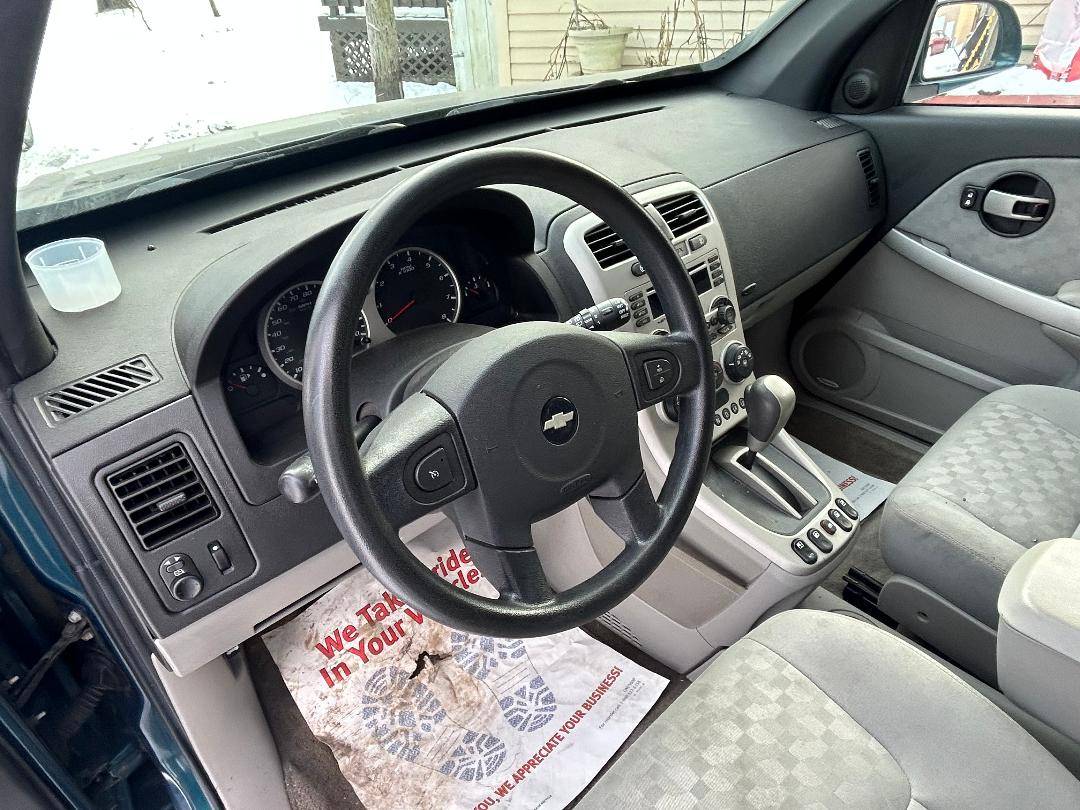 Interior view of a 2007 Chevrolet Equinox LT with clean upholstery and dashboard features.