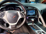 Interior view of a 2014 Chevrolet Corvette with dashboard and infotainment system