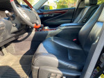 Interior view of a 2007 Lexus LS460 showcasing premium leather seats and luxury features.