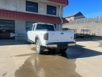 2002 Ford Ranger extended cab 4x4 parked outside, showing faded rear view and timing chain issue.