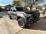 2018 Toyota Tacoma SR 4WD with a 2-inch lift and TRD Pro grill parked in driveway