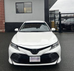 Front view of a 2018 Toyota Camry LE FWD in excellent condition for sale with low mileage.