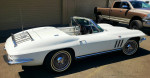 1965 Chevrolet Corvette Stingray Convertible in white, showcasing its sleek design and vintage appeal.