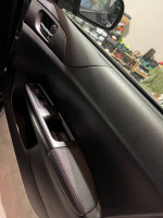 Interior door panel of 2012 Subaru Impreza WRX STI Limited featuring leather accents and high-quality materials.