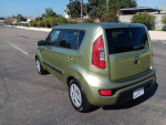 2013 Kia Soul in green with 110,000 miles, featuring clean title and new Michelin tires, parked in a sunny location.
