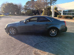 2009 Cadillac CTS in fair condition, featuring chrome wheels and parked in a sunny outdoor area.