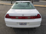 Rear view of a 2000 Honda Accord EX-L in pearl white with clean body and CA plates.