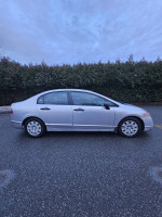 2006 Honda Civic in mint condition, low mileage with great fuel efficiency, shown from the side.