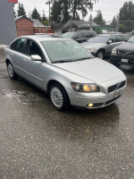2005 Volvo S40 2.4i sedan with recent maintenance and low mileage for sale, viewed in a parking lot.
