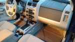 Interior view of a 2012 Ford Escape Hybrid with clean dashboard and seating, showcasing its modern features.