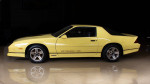 1987 Chevrolet Camaro Z/28 in mirror finish yellow, showcasing its sporty design and original features.