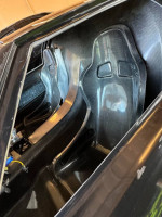 Interior view of Ford GT featuring custom carbon fiber racing seats.