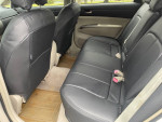 Interior view of a 2005 Toyota Prius with black leather seats, ideal for reliable and efficient driving.