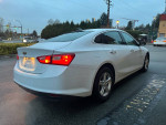 2020 Chevrolet Malibu LS FWD parked on a street, showcasing its sleek design and clean exterior