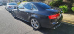 2011 Audi S4 Prestige parked, showcasing its sleek design and silver alloy wheels.