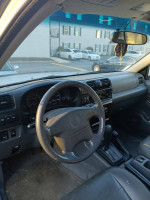 Interior view of a 2001 Honda Passport EX showing dashboard and steering wheel, available for sale.